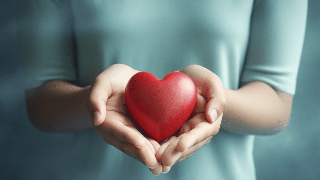 A person is holding a heart shaped object.