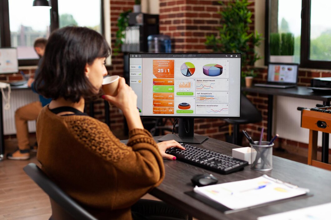 a woman working while drinking