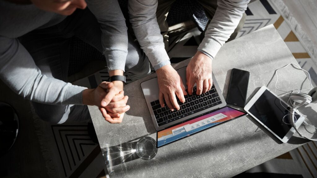 two businessman working in their laptop