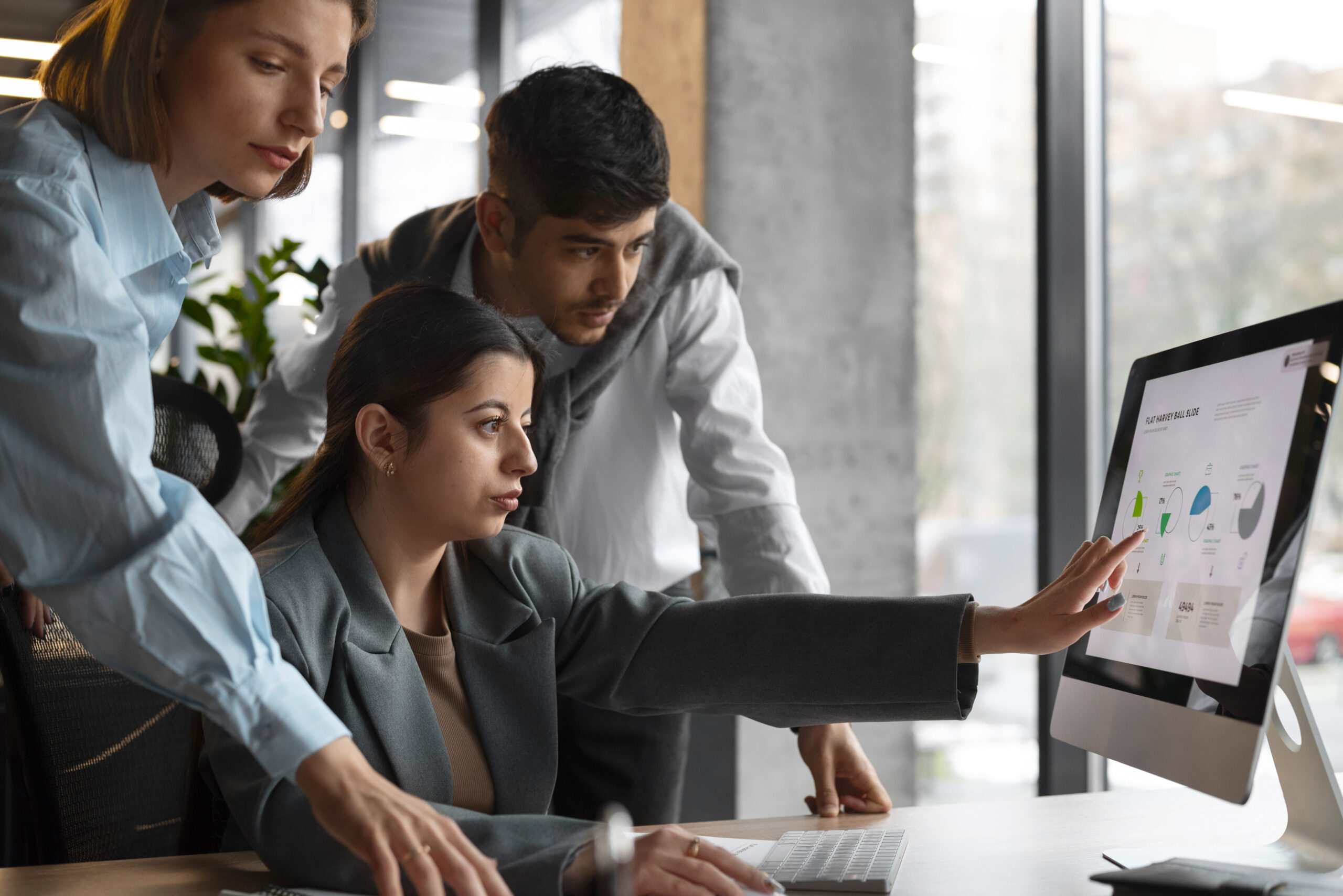 3 business people checking out in the monitor.